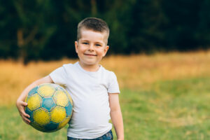 child with soccer ball